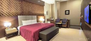 Katil atau katil-katil dalam bilik di Shantis Motel
