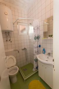 Koupelna v ubytování Apartments Kruno