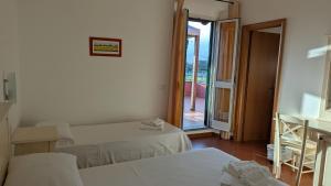 Voodi või voodid majutusasutuse Hotel Il Cipresso toas