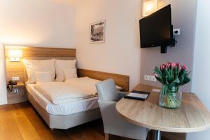 TV a/nebo společenská místnost v ubytování Hotel Perkeo