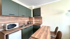 A kitchen or kitchenette at Evi Apartments 2