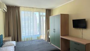 A bed or beds in a room at Evi Apartments 2