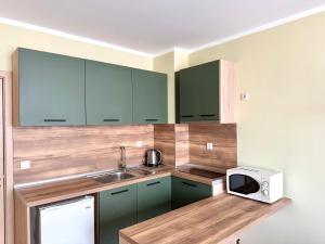 A kitchen or kitchenette at Evi Apartments 2