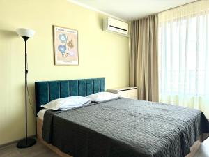 A bed or beds in a room at Evi Apartments 2
