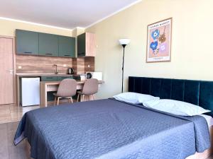 A bed or beds in a room at Evi Apartments 2