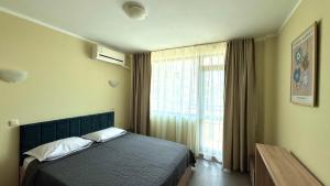 A bed or beds in a room at Evi Apartments 2