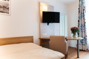 TV a/nebo společenská místnost v ubytování Hotel Perkeo