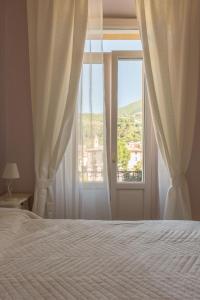 Postel nebo postele na pokoji v ubytování Hotel Maderno
