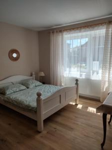 Rúm í herbergi á Hortenzie