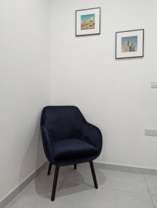 Posezení v ubytování Endor Ground Floor Apartment with backyard and garage in Gozo