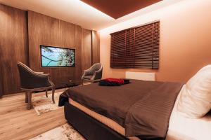 TV a/nebo společenská místnost v ubytování Motel Delphin