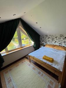 Postel nebo postele na pokoji v ubytování Dom we Fromborku