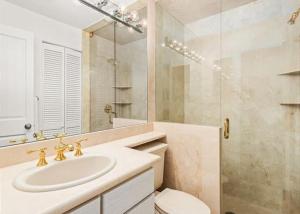 a bathroom with a sink and a toilet and a shower at Gold-Rated 2 Bedroom Condo At The Base Of Aspen Mountain in Aspen +12 photos