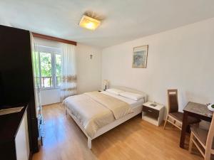 Postel nebo postele na pokoji v ubytování Apartments Tereza