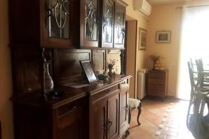 a kitchen with a counter with a laptop on it at Camera Friuli in Nettuno