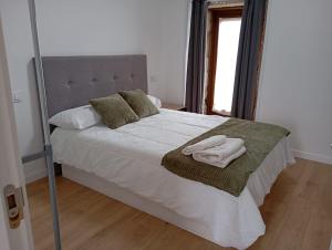 Albergue Turistico En Armenteira A Fragua do Ferreiro客房内的一张或多张床位