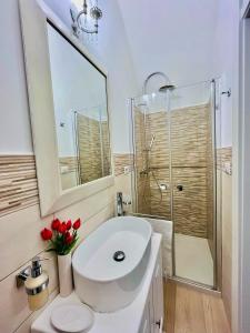 a bathroom with a toilet and a sink and a shower at Casa Vacanze Raimonda in Nardò