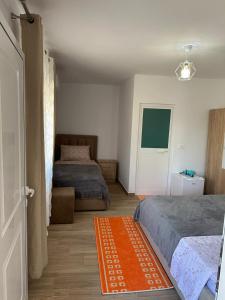 Postel nebo postele na pokoji v ubytování Vila Zefi