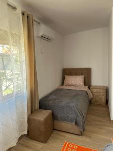 Postel nebo postele na pokoji v ubytování Vila Zefi