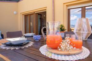 Thức uống tại Panoramic penthouse on the Gulf of Alghero
