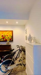 a bike parked in a room with a painting at Casa Vacanze Raimonda in Nardò
