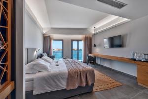 Voodi või voodid majutusasutuse Naves Suites toas