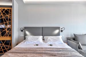 Voodi või voodid majutusasutuse Naves Suites toas