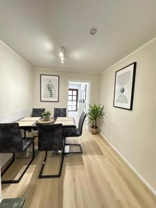 a dining room with a table and chairs at Schulz Apartments Siegburg in Siegburg