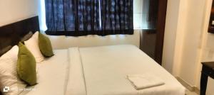 Postel nebo postele na pokoji v ubytování Hotel Star Simon delhi
