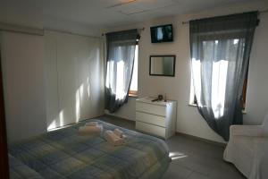 Postel nebo postele na pokoji v ubytování Borgo Tullio, casa vacanze a pochi passi da Udine