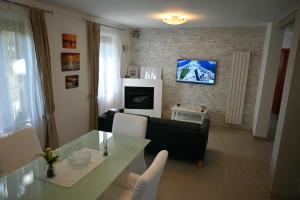 TV a/nebo společenská místnost v ubytování Borgo Tullio, casa vacanze a pochi passi da Udine