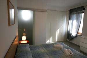 Postel nebo postele na pokoji v ubytování Borgo Tullio, casa vacanze a pochi passi da Udine