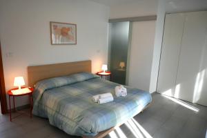 Postel nebo postele na pokoji v ubytování Borgo Tullio, casa vacanze a pochi passi da Udine