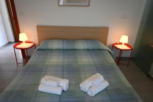 Postel nebo postele na pokoji v ubytování Borgo Tullio, casa vacanze a pochi passi da Udine