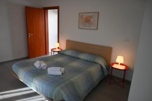 Postel nebo postele na pokoji v ubytování Borgo Tullio, casa vacanze a pochi passi da Udine