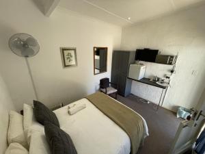 Ένα ή περισσότερα κρεβάτια σε δωμάτιο στο Lord Grey Guesthouse