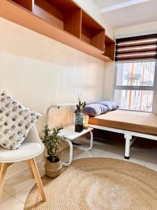a room with a bed and a window at VR Homes Ortigas - 2BR Condo with Free WiFi in Manila