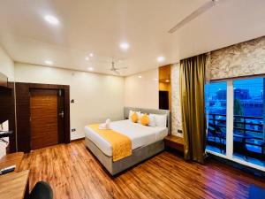 Letto o letti in una camera di Shankar Bhavan By Vinayak Hotels