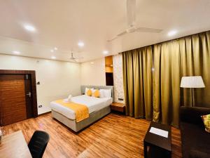 Letto o letti in una camera di Shankar Bhavan By Vinayak Hotels