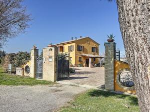 a house with a gate in front of it at Il Sentiero Del Poeta - Country House in Bagnola