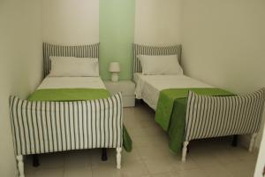 Postel nebo postele na pokoji v ubytování La Verde Marina