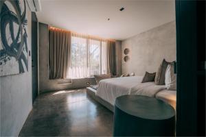 Voodi või voodid majutusasutuse Esh Hotel toas