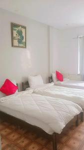 Katil atau katil-katil dalam bilik di Hotel Astoria Tanger