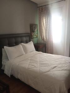 Katil atau katil-katil dalam bilik di Hotel Astoria Tanger