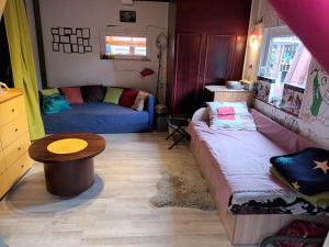 a living room with a couch and a table at Roberto ranch in Palanga