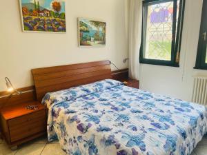 Ένα ή περισσότερα κρεβάτια σε δωμάτιο στο Villaggio Brenta