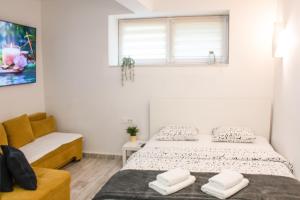 Postel nebo postele na pokoji v ubytování Downtown Zagreb Abode
