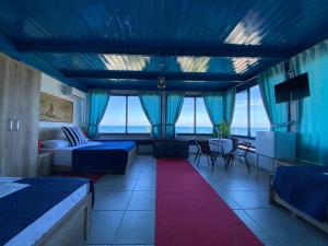 Postel nebo postele na pokoji v ubytování Tramonto Hotel