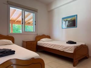 Ένα ή περισσότερα κρεβάτια σε δωμάτιο στο Sunset Villa Agia Thekla +19 φωτογραφίες