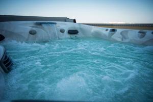 a pool of blue water in a water slide at B&B Agrimare SAN SALVO MARINA in San Salvo